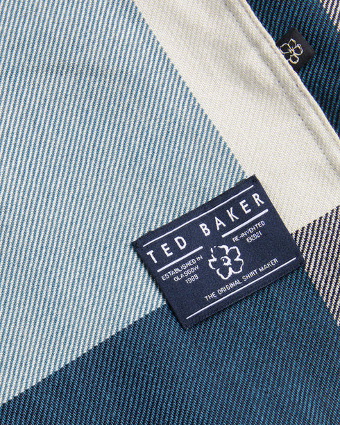 NEETLY-Shirts-Crafted from a blend of cotton and lyocell, NEETLY offers all-day comfort. This shirt's timeless silhouette adds to its wear-anywhere appeal, while the check print adds easy texture to your outfits. Button up shirt Large house check print Cotton and lyocell blend Long sleeves Classic collar Branded label O'Shea is 6'2.5" / 1.89m and wears Medium Blue in a Ted size 3- Ted Baker Romania